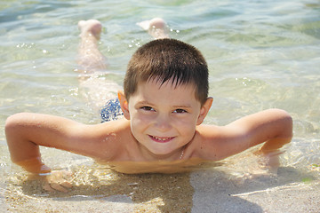 Image showing Smiling boy enjoying sea bathing