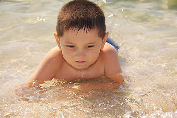 Image showing Kid enjoying sea bathing