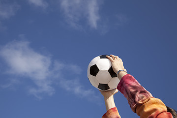 Image showing Hands holding a soccer ball