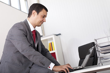 Image showing Mature businessman working at the office