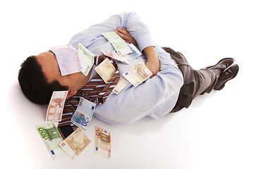 Image showing Sleeping with the money