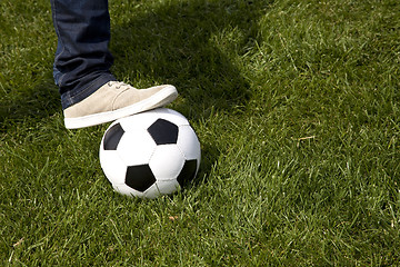 Image showing Human foot and a soccer ball