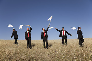 Image showing Group raise the white flag