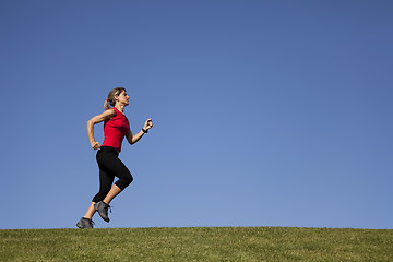 Image showing Running at the top of the hill