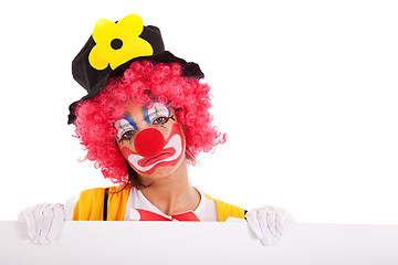 Image showing sad clown holding a banner