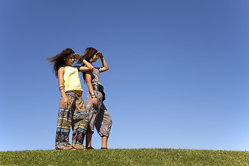 Image showing Happy sisters at the field