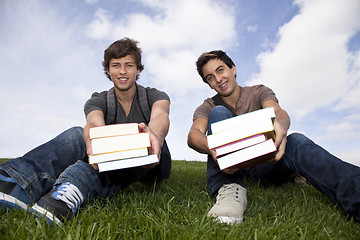 Image showing Students showing his school books