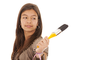 Image showing Teenager holding a brush