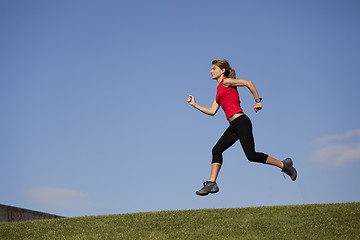 Image showing Running at the top of the hill