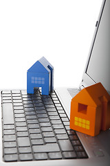 Image showing House toy over a laptop