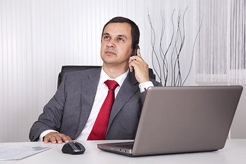 Image showing Mature businessman working at the office