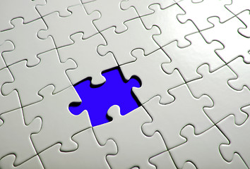 Image showing Missing puzzle  piece, focus around the empty space.