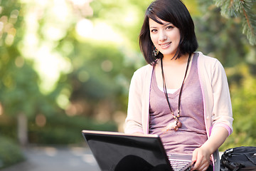 Image showing Mixed race college student with laptop