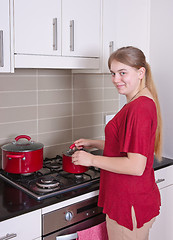 Image showing teenager cooking in the kitchen