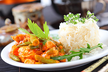 Image showing Red chicken curry stripes with rice