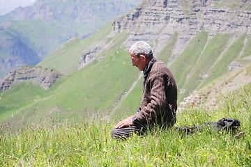 Image showing Praying man kneeling