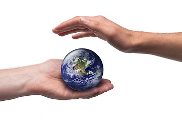 Image showing Globe and protective male hands