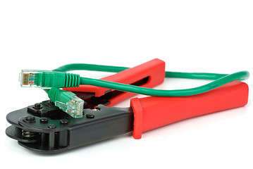 Image showing Crimping cutting tool and green patchcord