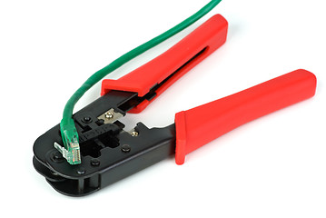 Image showing Crimping cutting tool and green patchcord