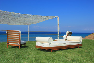 Image showing Sunbeds at the beach of luxury hotel