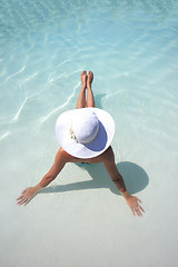 Image showing Woman in a pool hat relaxing