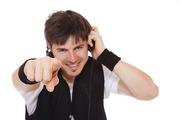 Image showing Casual man listening to music