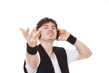 Image showing Casual man listening to music