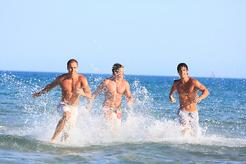 Image showing Men Relaxing On the Beach