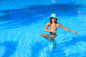 Image showing Young woman in the pool 