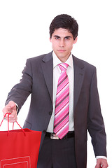 Image showing young man with shopping bags 