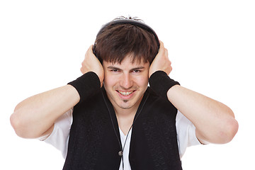 Image showing Casual man listening to music