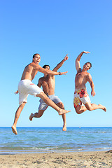 Image showing Men Relaxing On the Beach