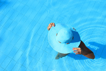 Image showing Young woman in the pool 