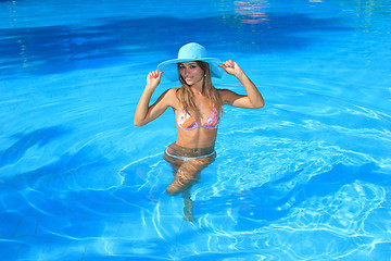 Image showing Young woman in the pool 