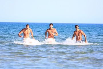 Image showing Men Relaxing On the Beach