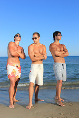 Image showing Men Relaxing On the Beach