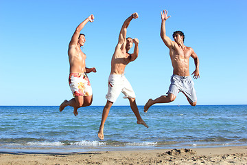 Image showing Men Relaxing On the Beach