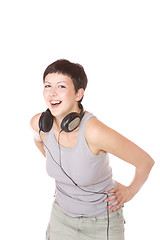 Image showing Woman with headphones listening to music