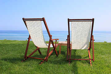 Image showing Sunbeds at the beach of luxury hotel