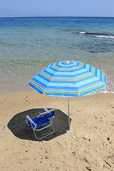 Image showing An empty chair on a  beach 
