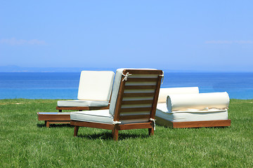 Image showing Sunbeds at the beach of luxury hotel