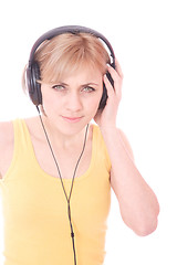 Image showing Woman with headphones listening to music