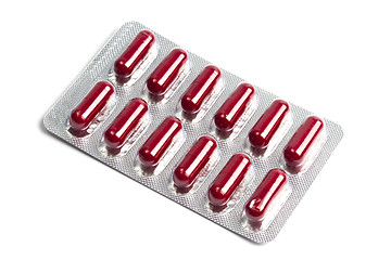 Image showing Red capsules packed in blister