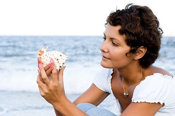 Image showing woman on seacoast with a cockleshell