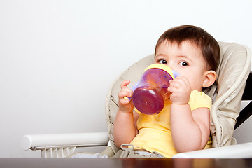 Image showing Baby infant drinking from sippy cup