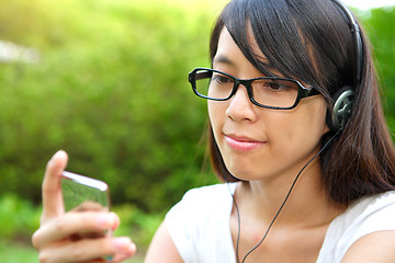 Image showing Pretty young girl listening music
