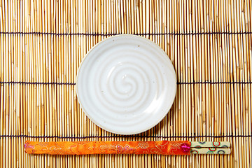 Image showing plate and chopsticks