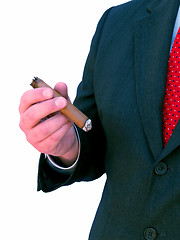 Image showing businessman smoking a cigar