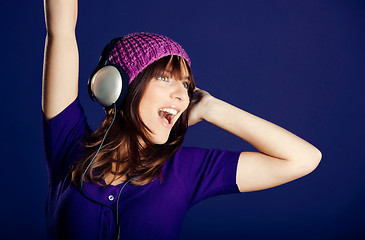 Image showing Beautiful woman listening music