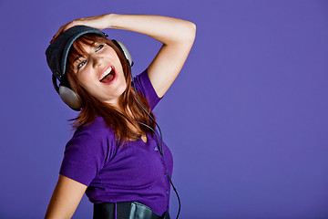 Image showing Beautiful woman listening music